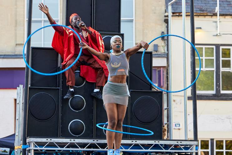 A person performing with hoops