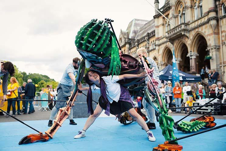 outdoor performance with giant puppet