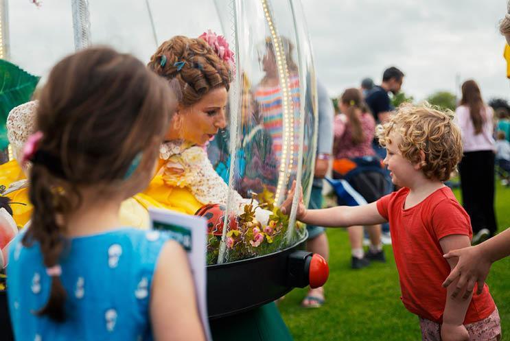 child looking at globe