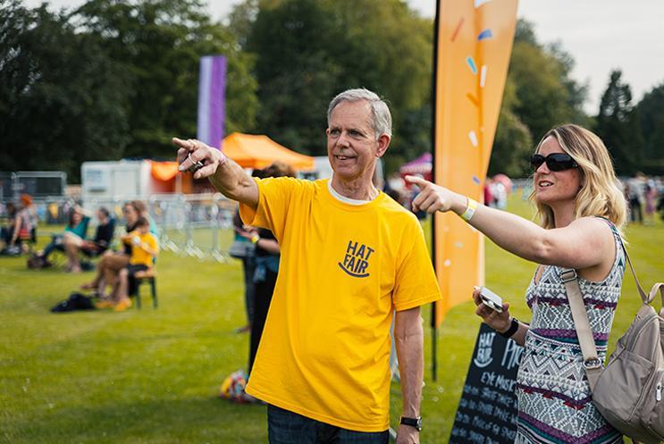 volunteer helping festival goer