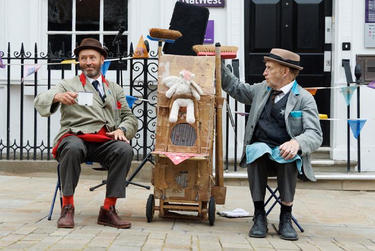 Rudkin and Hicks sat with tea about to perform.