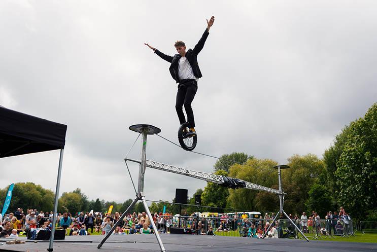 man on unicycle on high wire