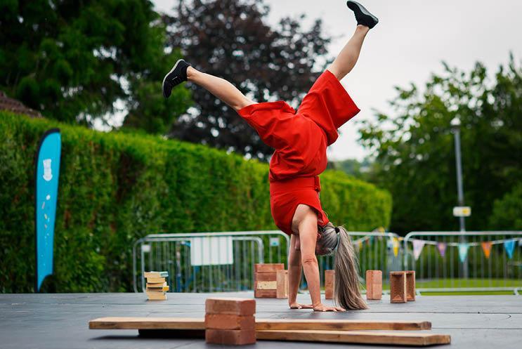 Lady doing a hand stand