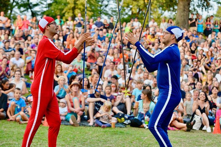 Two people performing to a crowd