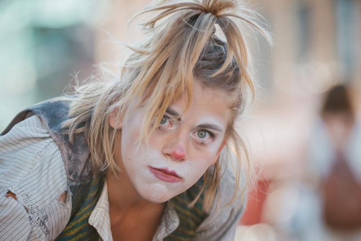 A lost clown looking straight down the camera lense.