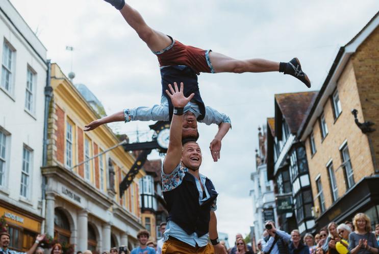 Men performing acrobatics outdoors